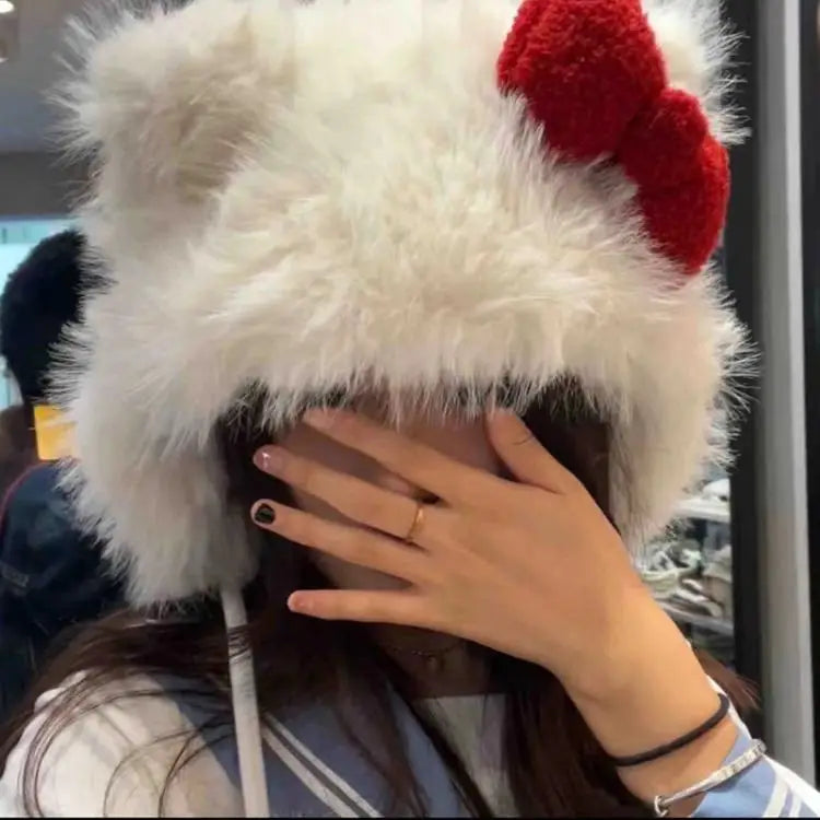 Stay warm and stylish with this Hello Kitty Plush Bomber Cap! Featuring a sweet red bow and cozy ear flaps, it’s the perfect winter accessory for Hello Kitty fans